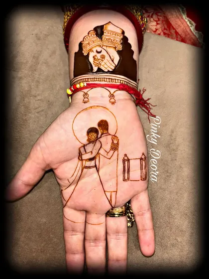 The first few strokes of a Karwa Chauth design, showing the outline of a couple and the ritual of holding hands. Even in its simplest form, the art tells a story of love.