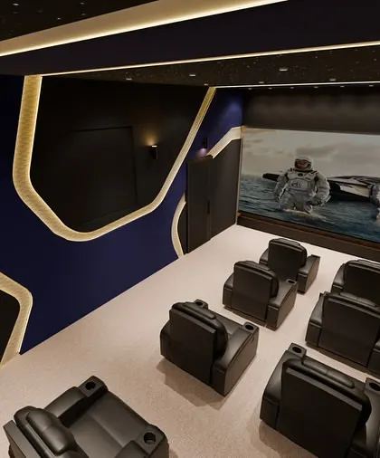 An overhead view of this unique, futuristic theater. The asymmetrical wall panels and lighting create a dynamic and unconventional space that breaks from the traditional boxy theater design.