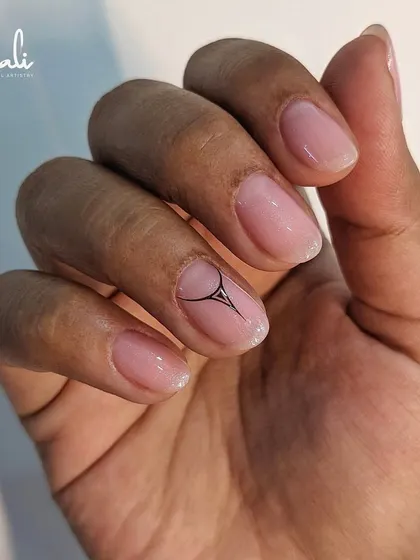 A minimalist design with a single, graphic black accent on a sheer pink base. It's subtle, modern, and chic.