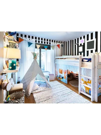 A fun and adventurous kid's room, complete with a bunk bed and a teepee. The black and white striped wall adds a bold graphic element to this playful sanctuary.
