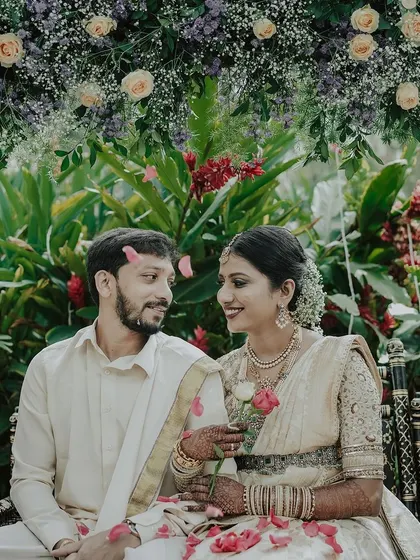 A lovely couple enjoying a moment on a traditional swing (oonjal), which we decorated with a lush arch of flowers. The swing is an important part of many South Indian ceremonies.
