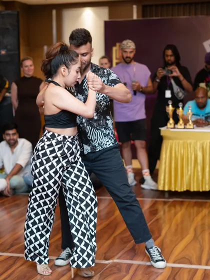 Another shot from the Olympiad of Kizomba qualifier held at our 'Bailar Conmigo 2.0' festival. You can see the judges and audience in the background, highlighting the competitive environment we prepare our students for.
