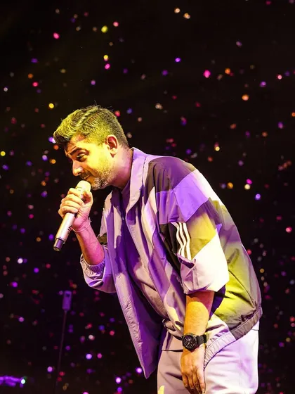 Jigar Saraiya engaging with the audience under a shower of confetti at NIT Surat. We focus on creating an immersive and interactive show for the students.