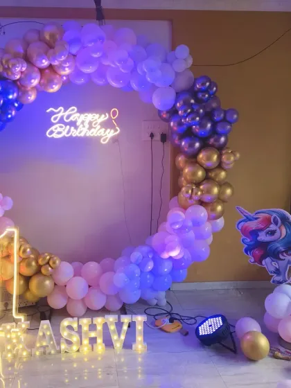 Another angle of the unicorn-themed first birthday, showing the setup in a home environment.