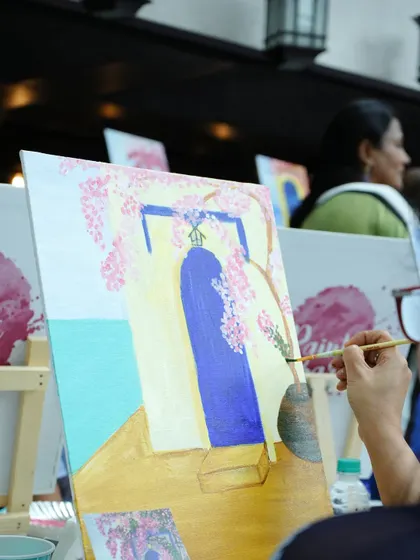 A guest adding the finishing touches to their painting at a birthday party. We love using pre-drawn outlines for themed events like this one, making it easy for everyone to create a beautiful piece.