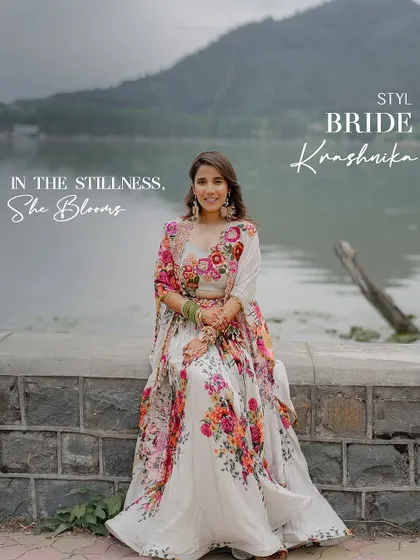 In the stillness, she blooms. For her Haldi ceremony by the Dal Lake, we styled the bride in a stunning floral Gazal Gupta lehenga that felt as fresh and beautiful as the surroundings.