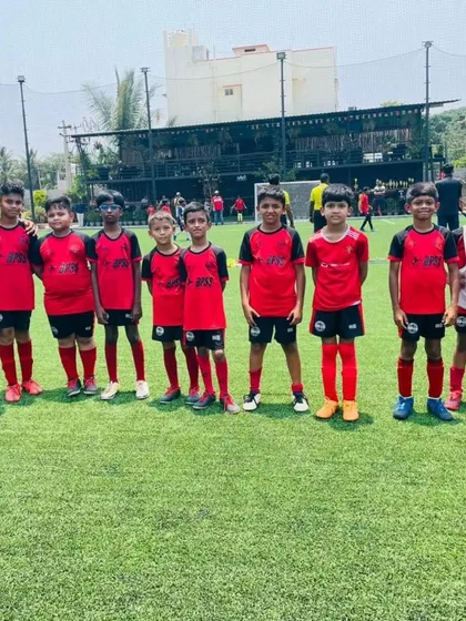 The U-9 team with their coach, getting ready for their TFP Cup match.