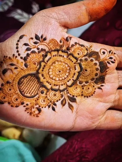 The same floral mandala design, showing the clean lines and intricate details I create with my organic henna paste.