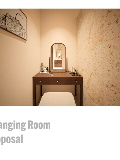 This proposal for the ladies' changing room includes a dedicated vanity station. The render visualizes a quiet corner with a comfortable seat, elegant mirror, and a backdrop of colonial gold stone, creating a private and luxurious space.