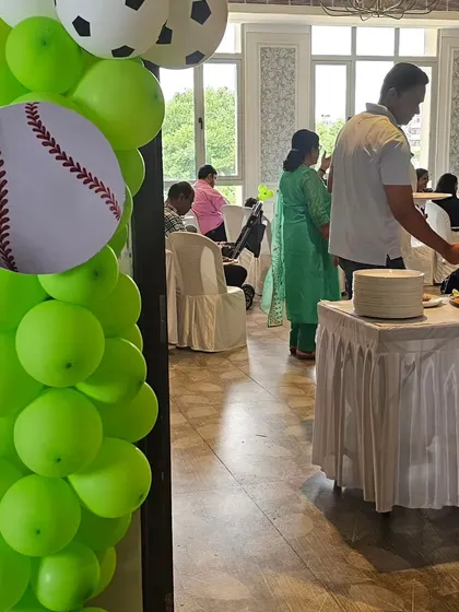 A glimpse of a football-themed birthday party, complete with fun sports-themed balloons. We handle events of all sizes, ensuring the food and setup match your party's energy.