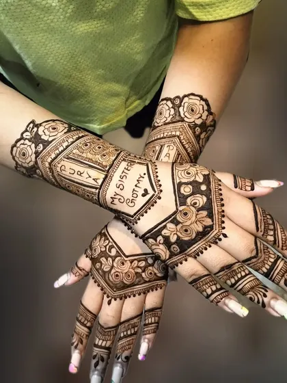 Another shot of the bride's sister's mehndi, showing how the geometric and floral patterns complement the personalized text.