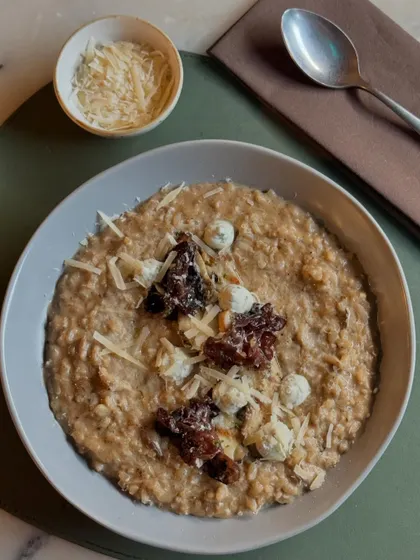 Our Wild Mushroom and Truffle Risotto, served with extra parmesan on the side. A classic dish executed with care and premium ingredients.