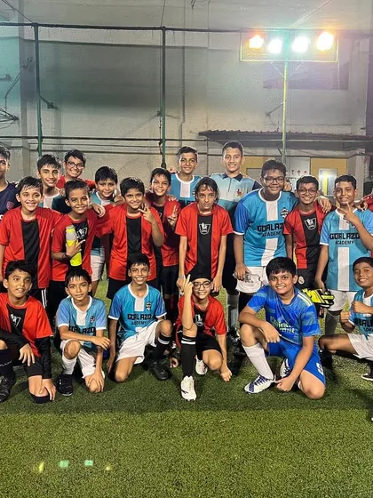 Our Under-13 players with the Usha Nagar FC team after a friendly match, an amazing experience for everyone involved.