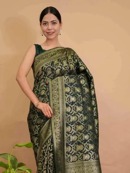 A timeless black Banarasi silk saree with intricate gold weaving, pre-stitched for modern convenience. This is a classic piece that exudes sophistication and is perfect for any formal event.