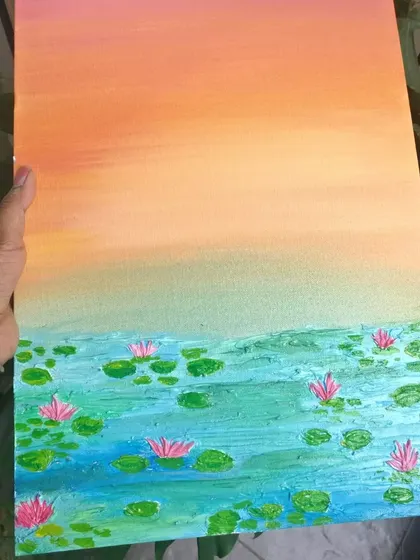 The full water lily pond painting, held to show its size.