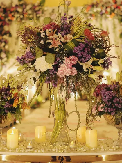 A close-up of the magnificent entrance floral arrangement, a mix of exotic flowers and lush greenery.