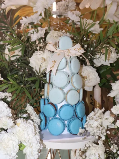 Another look at our beautiful blue ombré macaron tower, surrounded by fresh white flowers.
