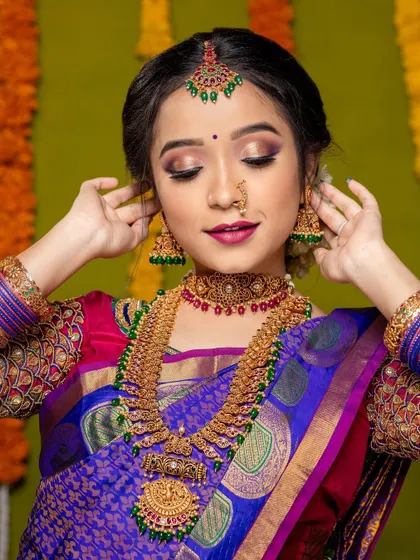 A duplicate of a stunning bridal portrait, perfect for showcasing the intricate details of the makeup and jewellery.