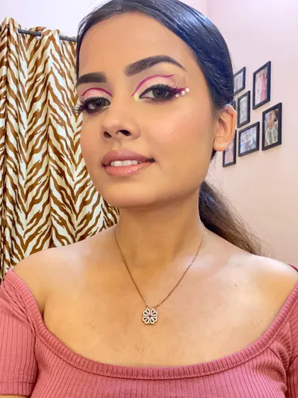 This angle shows how the graphic liner lifts and defines the eye. It's a playful and fashionable look for someone who loves to experiment with makeup.