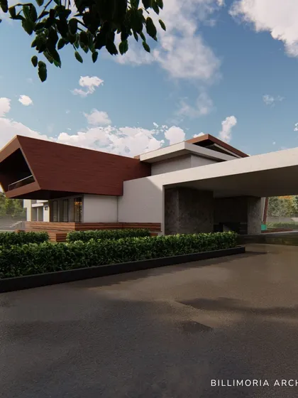 The entrance driveway leads under a wide, covered porte-cochère, providing a grand sense of arrival. The design uses a mix of stone, wood, and white render for a warm, contemporary material palette.