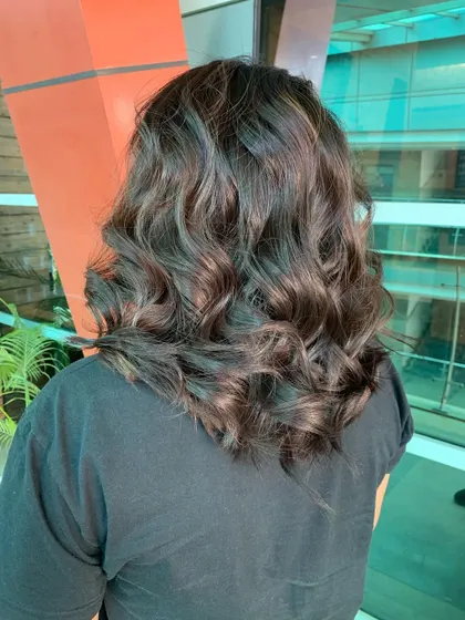 The same subtle highlights from a slightly different perspective, showing the gentle lift it gives the overall hair colour.