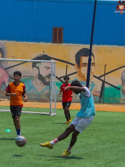 The follow-through is just as important as the strike. This shot captures the complete motion of a powerful kick, a key element we refine in our shooting drills.
