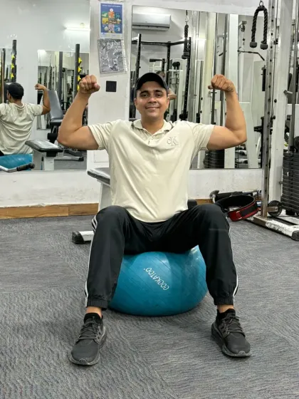 Double bicep flex on the ball.