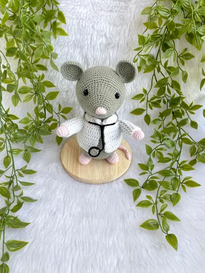 Dr. Mouse! This was a custom order for a graduation gift. The mouse is dressed in a doctor's apron with a tiny stethoscope and comes on a wooden base to be a display piece.