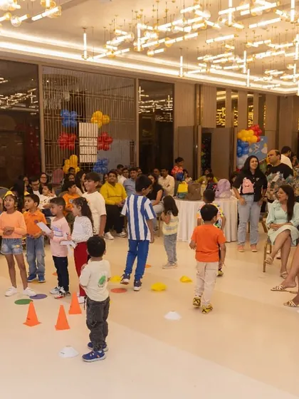 An organized group game in progress, led by a professional party host to keep the energy up.