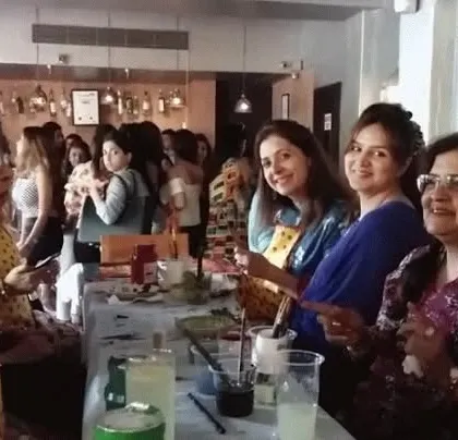 A candid shot from a bustling art party. The atmosphere is always filled with laughter, conversation, and the quiet hum of creativity.