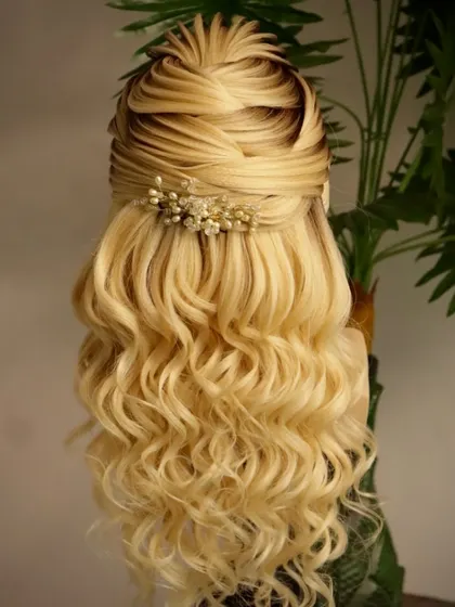 A perfect hairstyle for an unforgettable engagement. This open style with a textured front and soft curls is a beautiful choice for any bride-to-be.