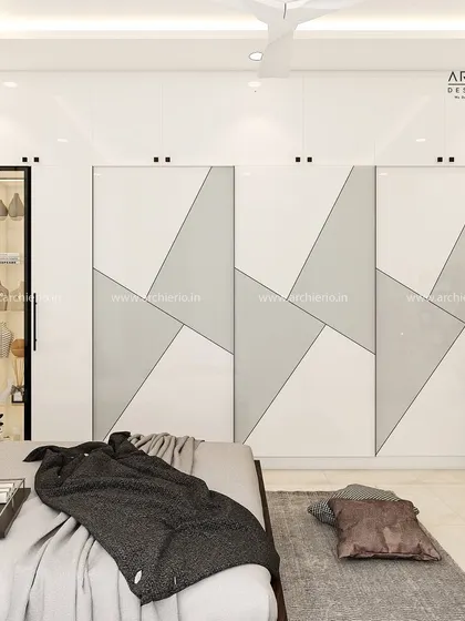 A sleek, modern sliding wardrobe with a bold black-and-white geometric design, making a strong style statement.