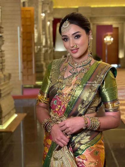 A full portrait of the cousin's Muhurtham look, showcasing her confident and glamorous style.