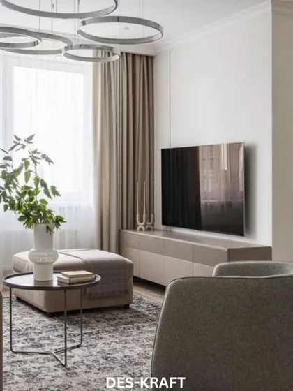 A wider perspective of the living room, showing the comfortable seating arrangement and the ample natural light that makes the space feel open and airy.