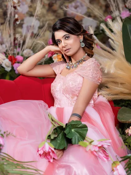 Another view of the pink ball gown, perfect for a romantic, floral-themed photoshoot.