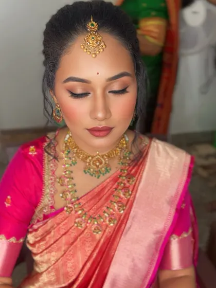 The makeup looks flawless from every angle, enhancing her natural beauty without feeling heavy.