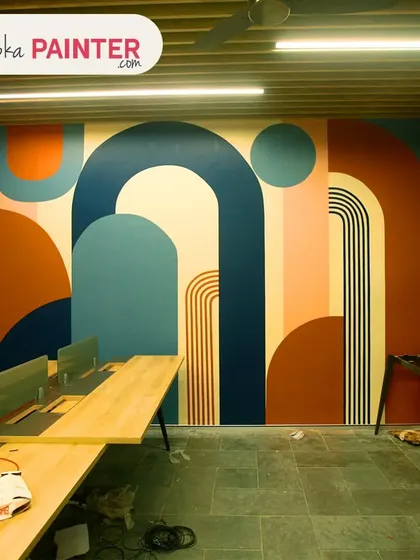 Another angle of the finished boho abstract mural in this office. The design wraps around the space, ensuring a cohesive and impactful look from every viewpoint.