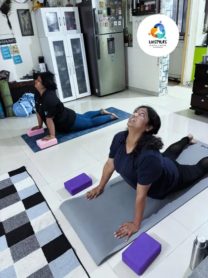 Yoga is for every body. In this session, two clients use yoga blocks to support them in Bhujangasana (Cobra Pose), modifying the posture to suit their flexibility while still getting the full benefit of the backbend.