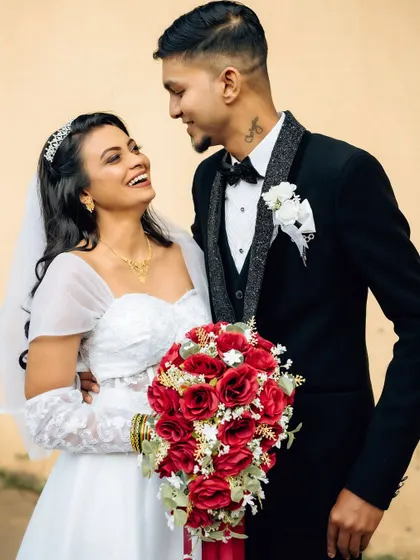 A joyful and candid interaction between the bride and groom. Capturing these moments of spontaneous laughter is a key part of my documentary approach.