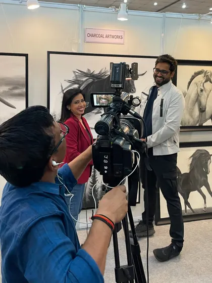 Being interviewed by DD INDIA at my exhibition booth. It's always a pleasure to share my artistic vision with a wider audience.