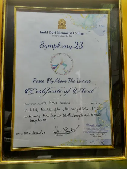 My certificate of merit for winning first prize in the Anjali Rangoli and Mehandi Competition at Janki Devi Memorial College in 2023.
