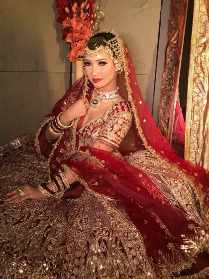 A full portrait of a classic bride, ready for her big day. The makeup is set for longevity and photographs beautifully, ensuring she looks flawless from every angle.