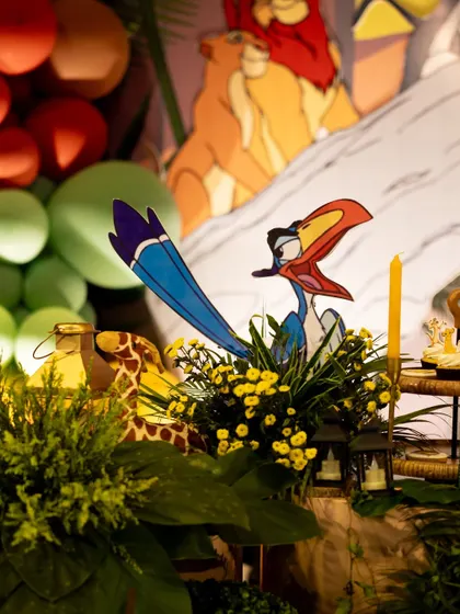 Zazu, the hornbill, makes an appearance in this detailed decor shot, nestled among yellow flowers and jungle foliage.