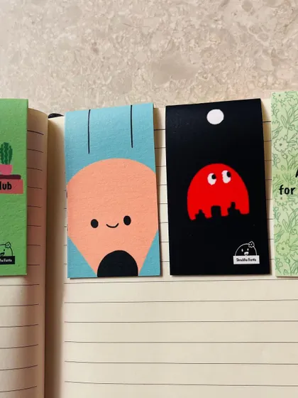 A colorful lineup of my magnetic bookmarks, each with a unique and quirky design.