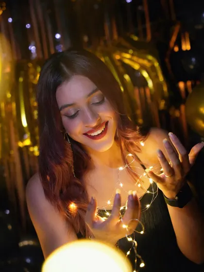 I love adding little touches like fairy lights. They can be woven into the decor or used for photos, adding a soft, magical glow to the party atmosphere, as seen in this stylish birthday shoot.