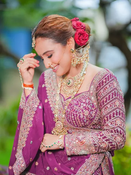 A candid moment of happiness. This photo captures the bride's radiant smile, a result of feeling confident and beautiful on her special day. The soft makeup looks great even in natural light.