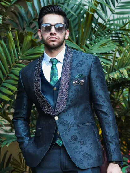 A full shot of the navy blue patterned suit, showing the complete look from head to toe.
