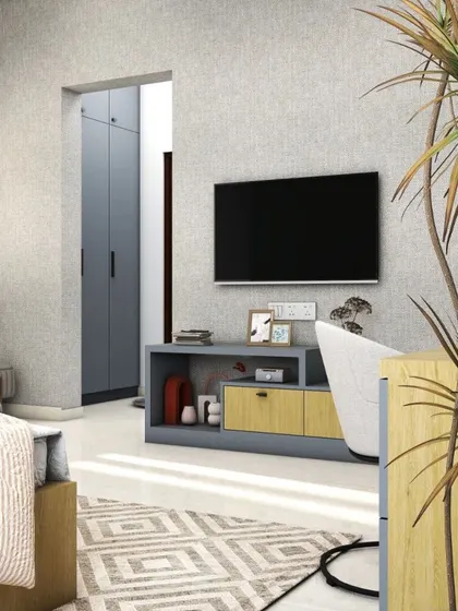 This bedroom features a simple yet elegant TV unit, demonstrating how we can incorporate entertainment options without cluttering the space. The design maintains a clean and relaxing feel.