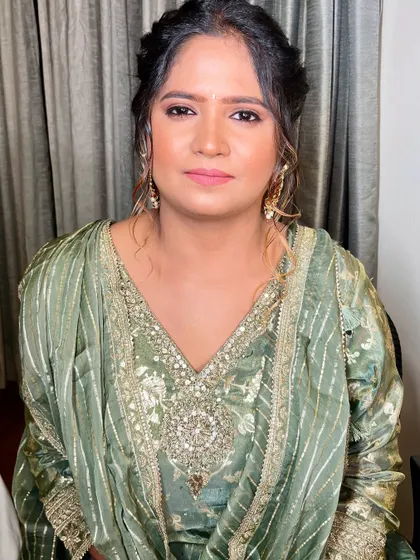 A happy and glowing bride-to-be. The minimal makeup allows her natural beauty and happiness to be the focus.