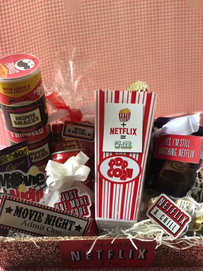 Getting into the Valentine's Day spirit with this fun Netflix & Chill hamper. It's packed with popcorn, snacks, and movie-themed goodies for a perfect night in.